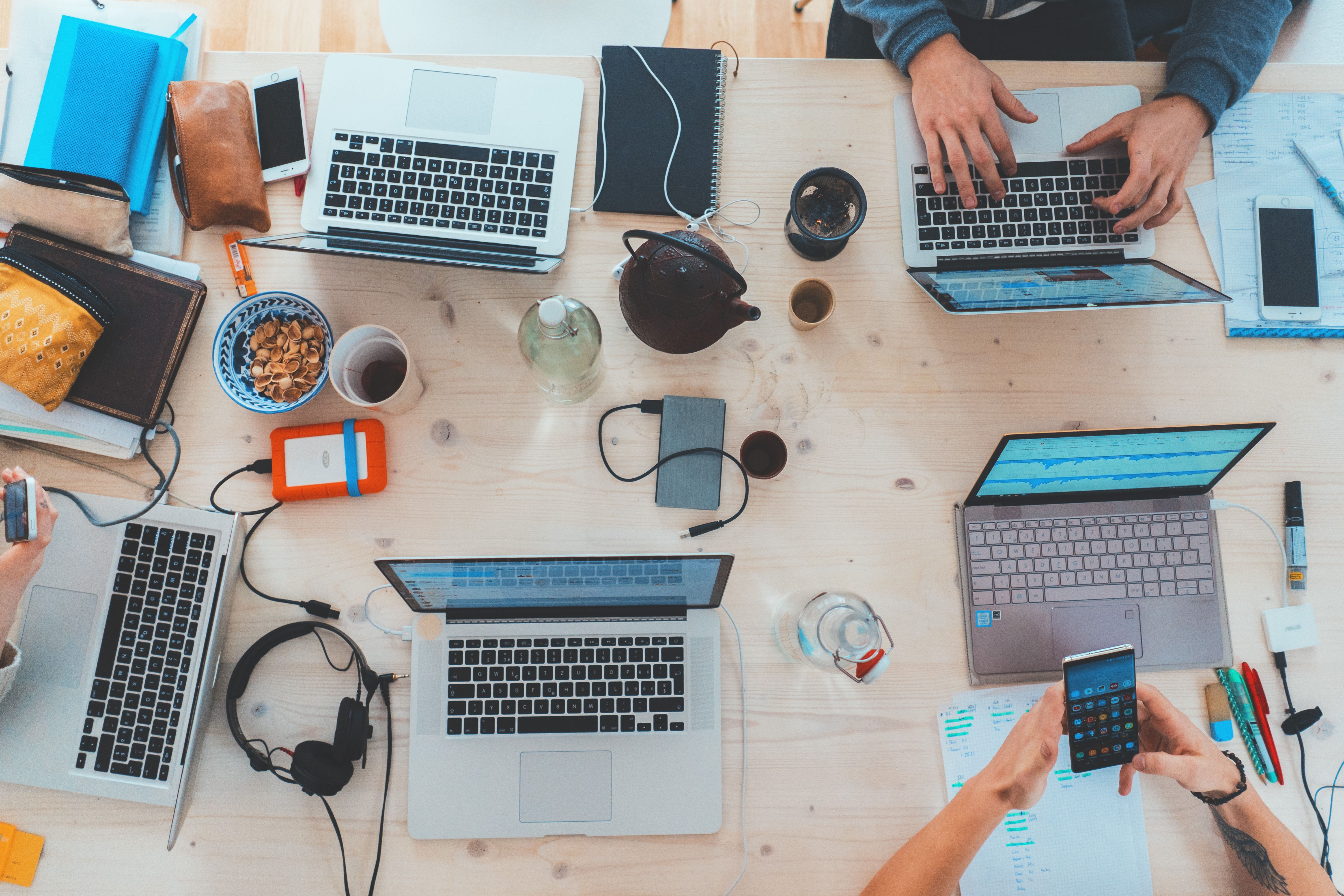 Laptops on a shared workspace